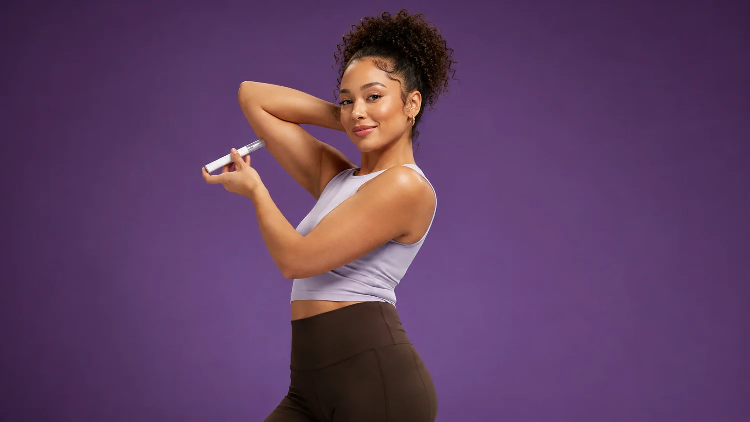 Woman holding a weight-management injection pen
